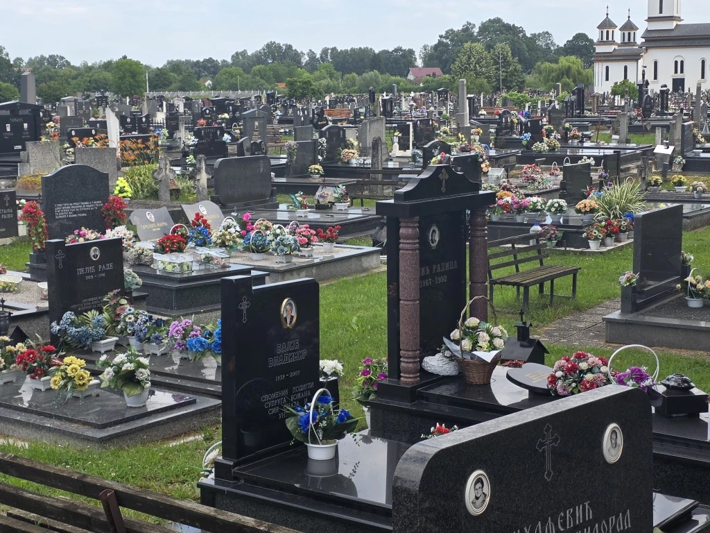 A graveyard with lots of flowers in Croatia.